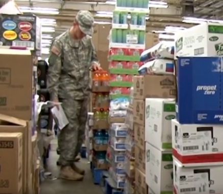 Soldier inspecting food in commissary