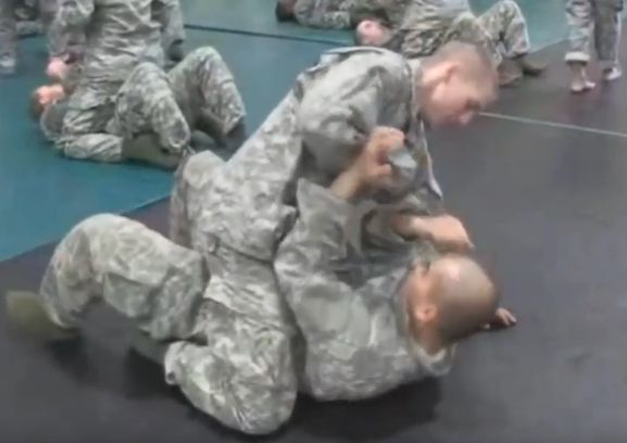 Soldiers receiving combatives training