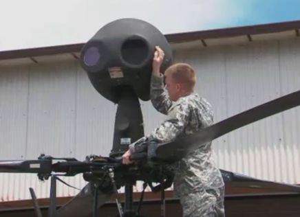 Soldier maintaining OH-58D mast-mounted sight