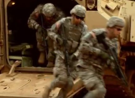 Soldiers exiting armored personnel carrier