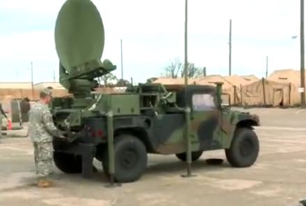 Soldier setting up a satellite link